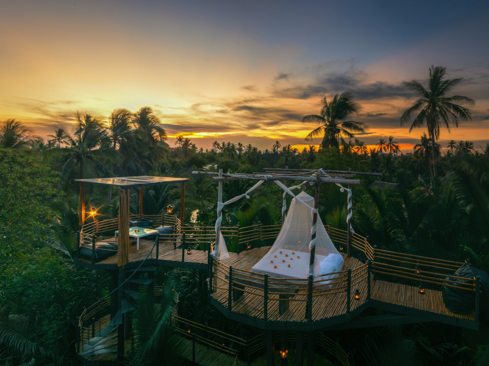 Where to stay in Bangkok | dawn breaks over the forest and an open-air sleeping platform at Bangkok Treehouse