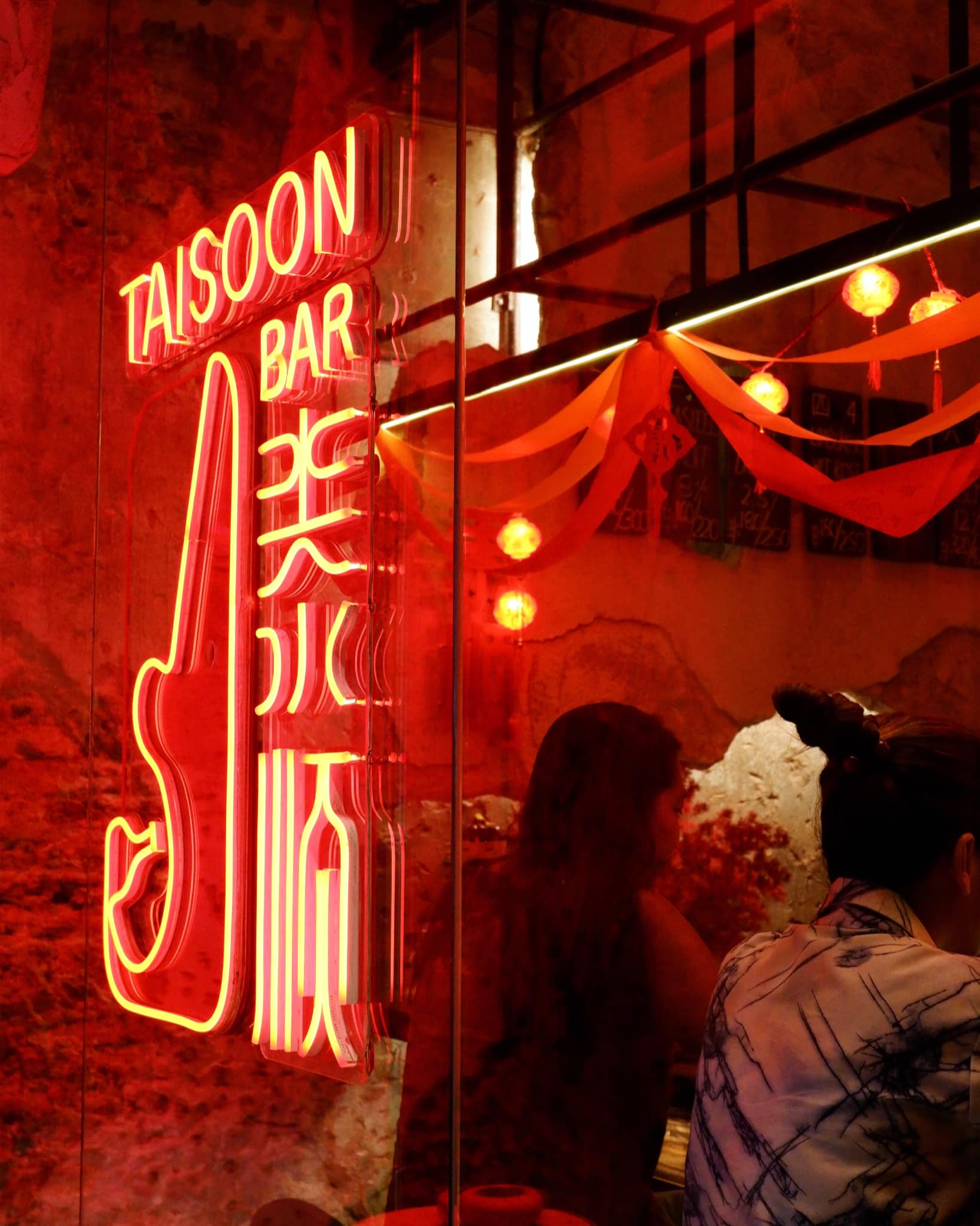 Bangkok's best bars | Red neon signage outside Tai Soon