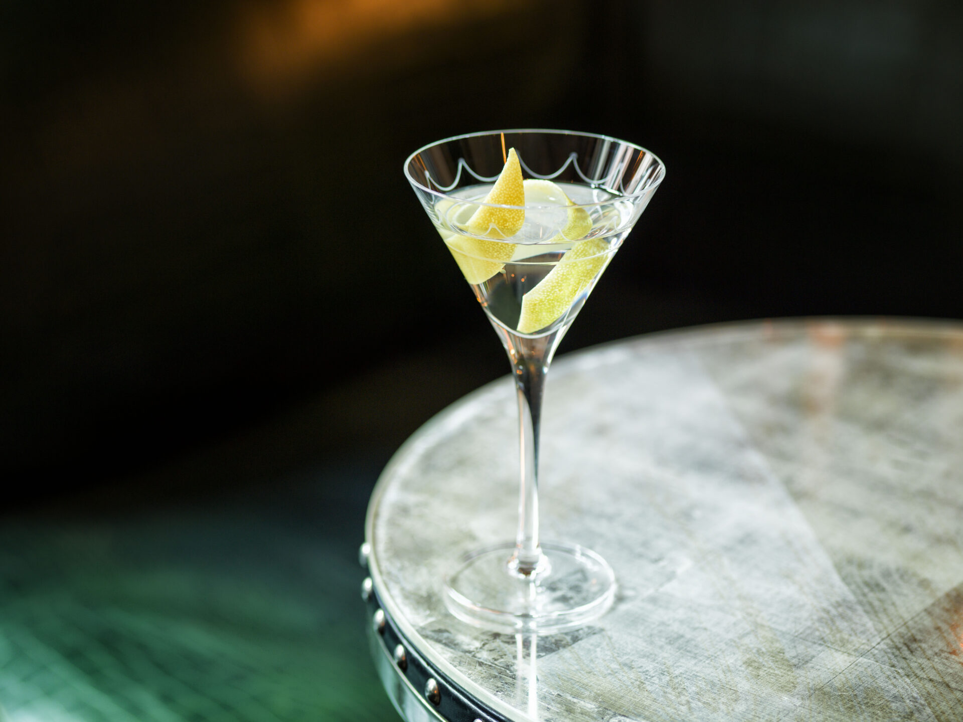 London's best cocktail bars | The Connaught's iconic martini with a lemon twist on a marble table