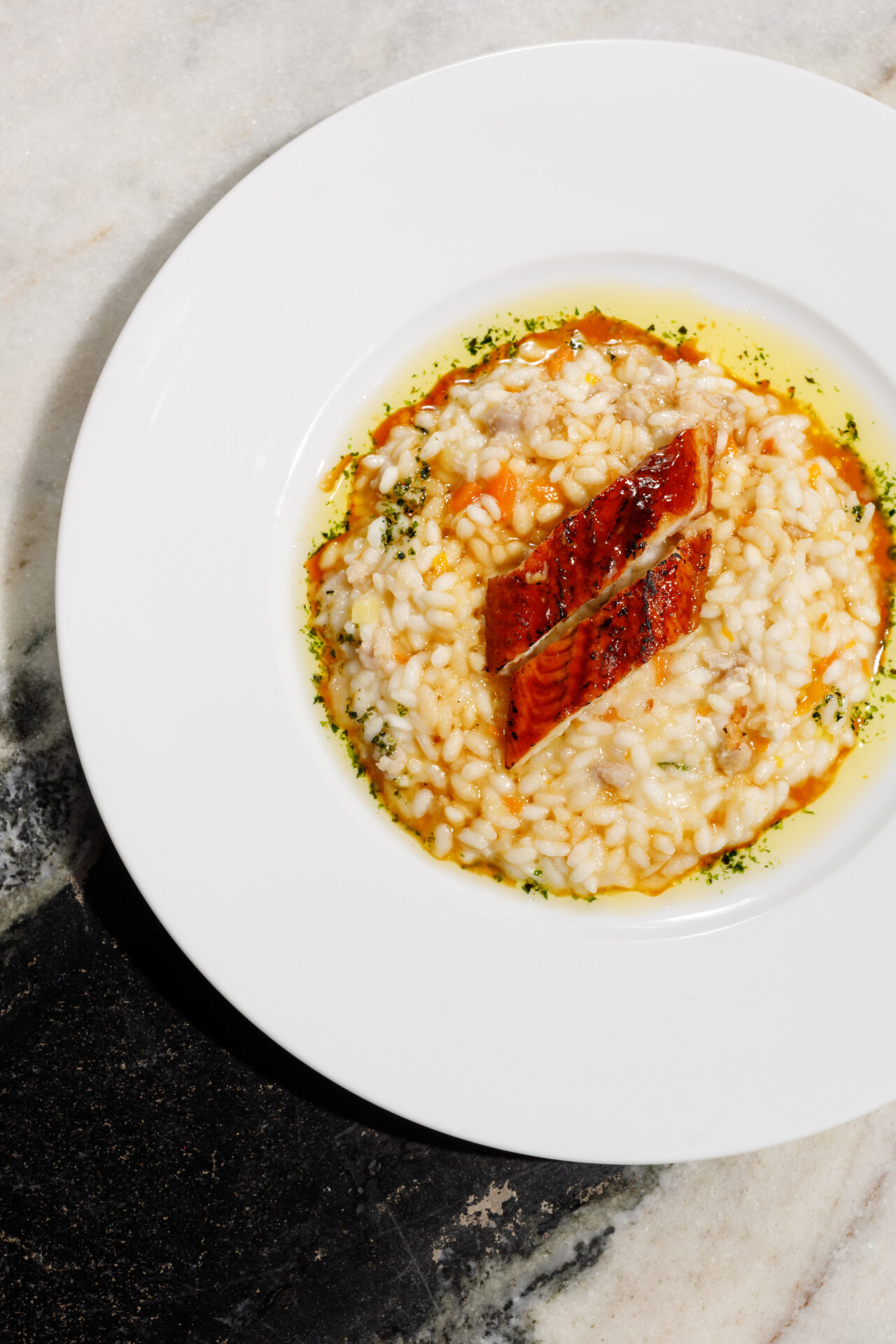 The best restaurants in Hackey | A large white bowl of kakuni pork and cuttlefish risotto at Angelina