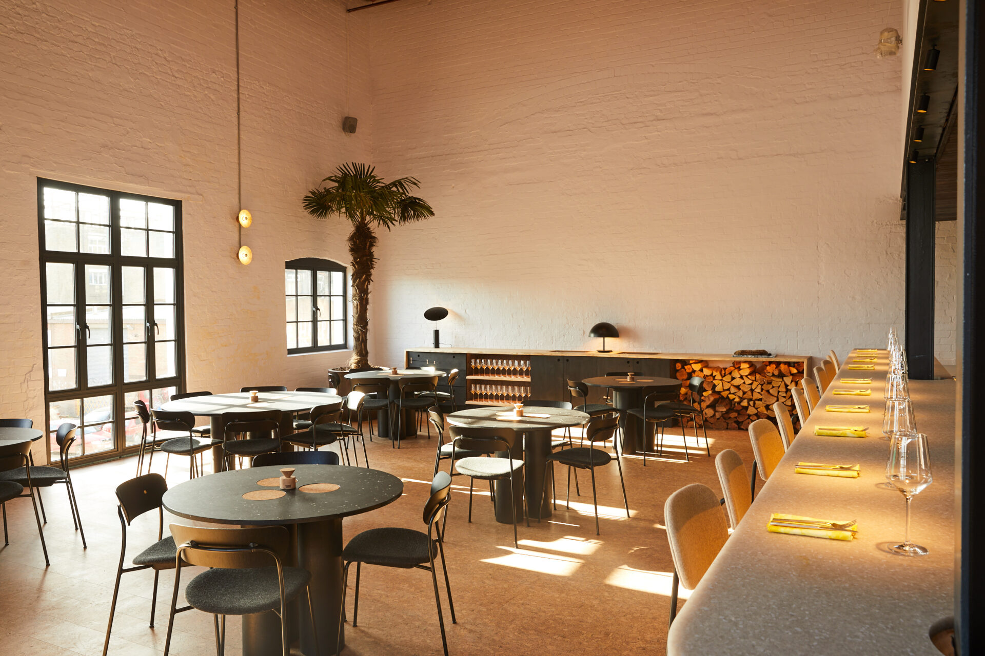The best restaurants in Hackney | An interior view of Silo, with chairs and tables and light passing through a crittal window