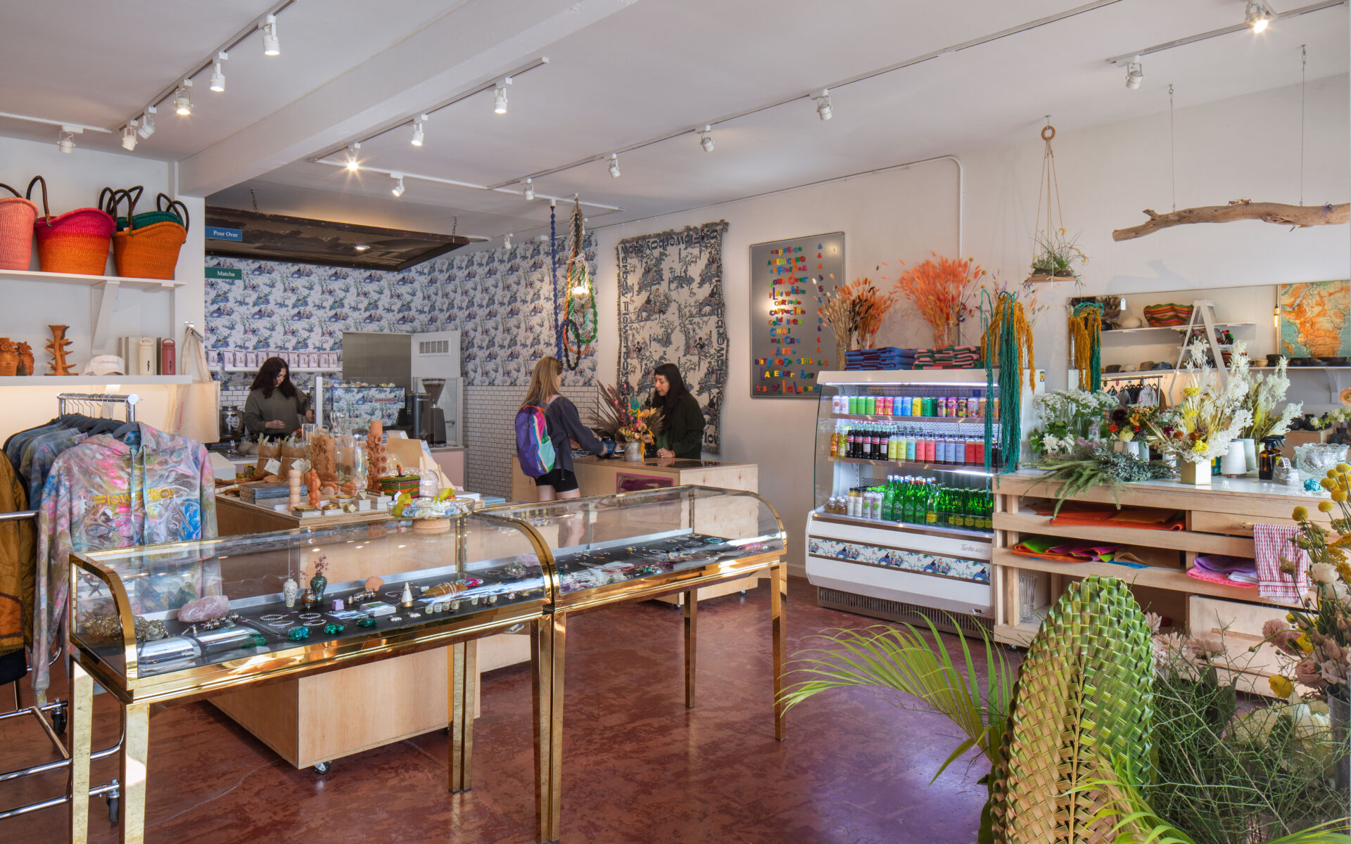 LA's best coffee shops | a terracotta tiled floor, while walls and colourful products on display at The Flowerboy Project