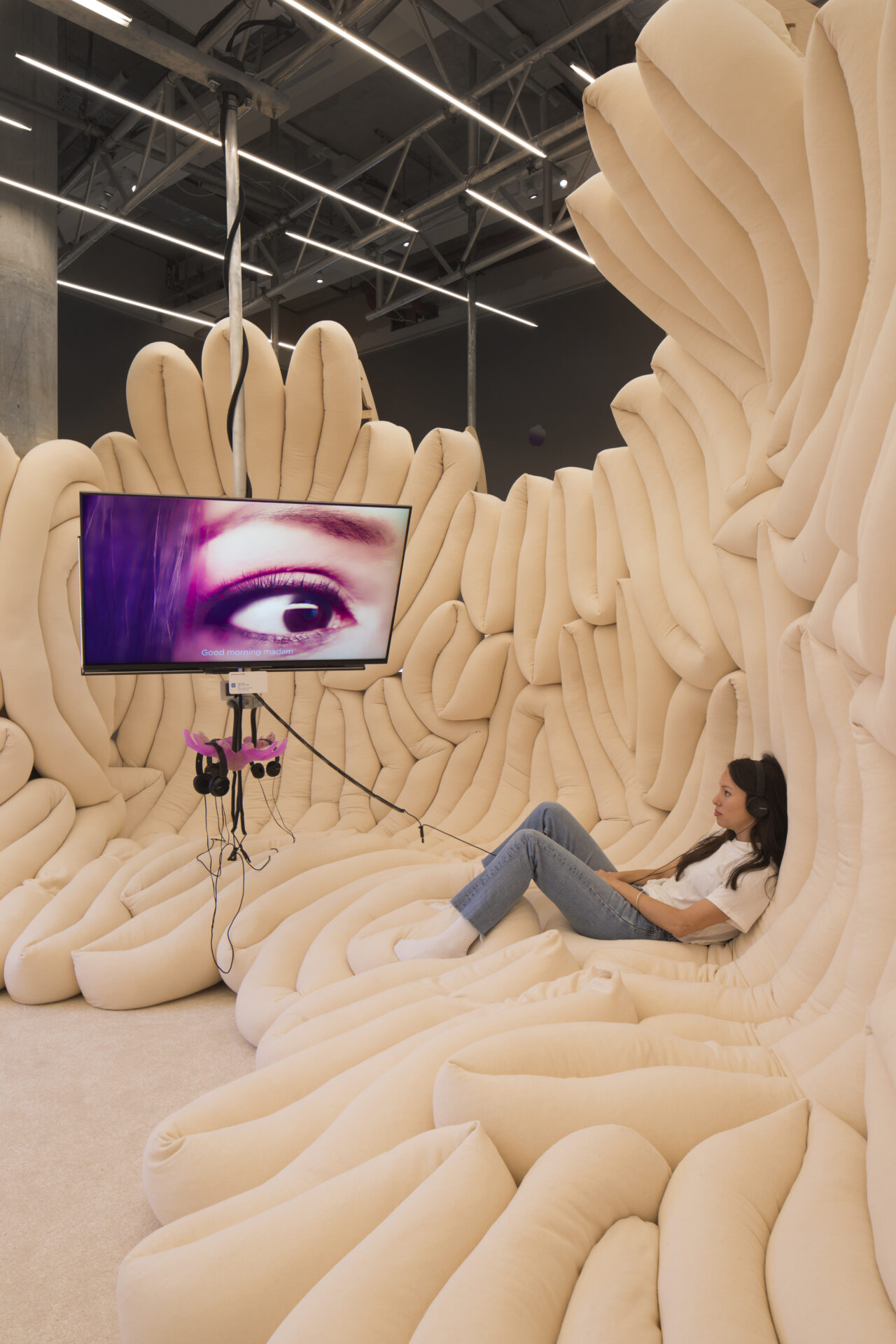 Things to do in London in June | A screen showing an eye and a wall of tubular-pattenered material at Weird Sensations at the Design Museum