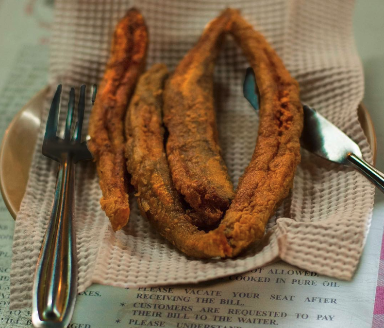 The best restaurants in Mumbai | Britannia & Co's bombil, a long sausage-shaped dish coated in special spiced batter