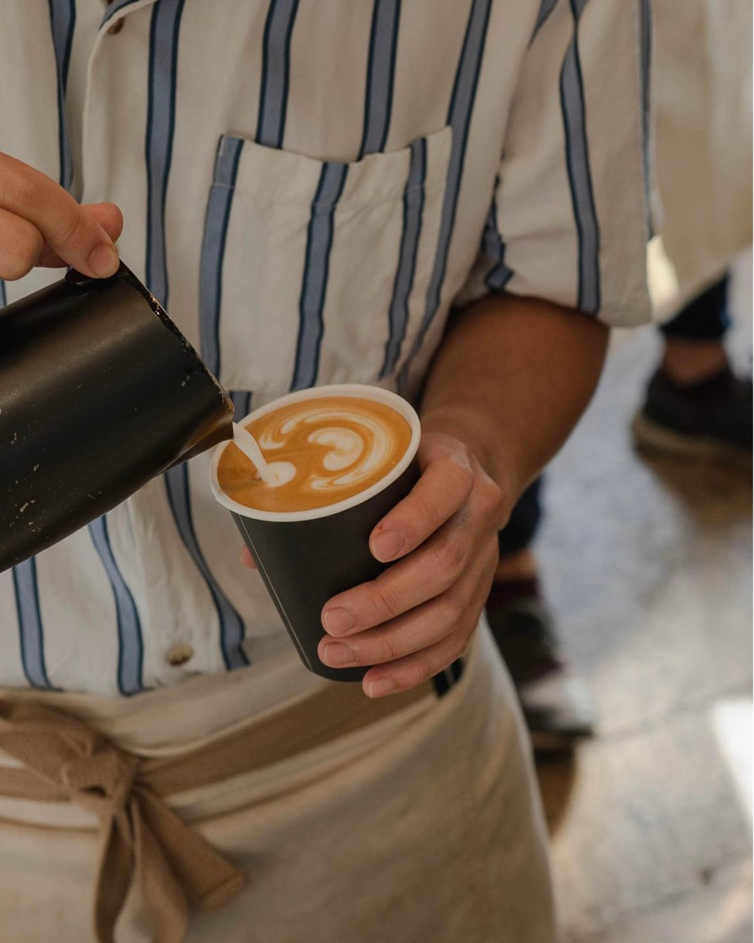 Freshly roasted coffee poured at Kumquat Coffee Co, Los Angeles