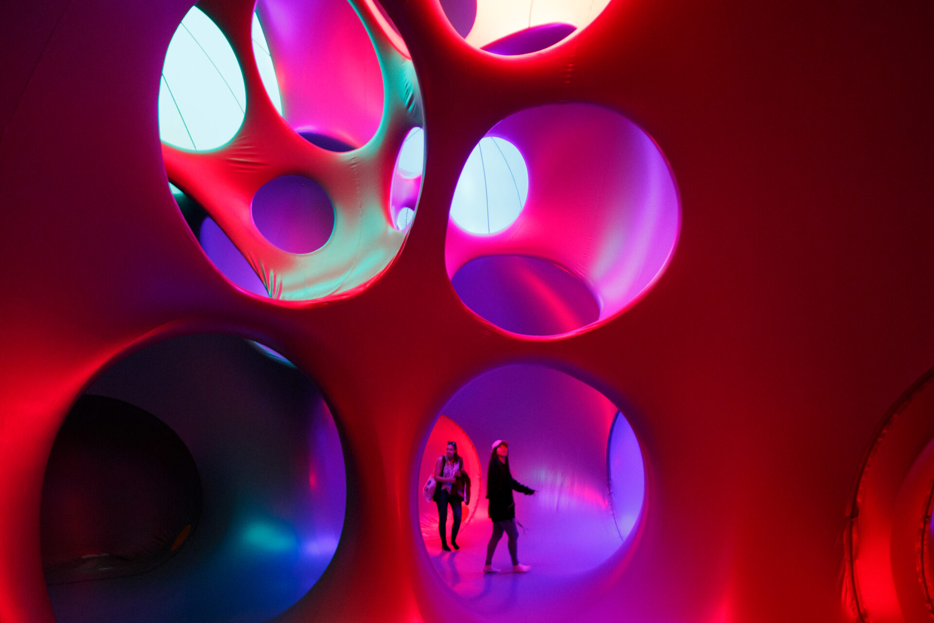 Things to do in London in June | A red, pink and purple construction filled with large holes at the London Festival of Architecture