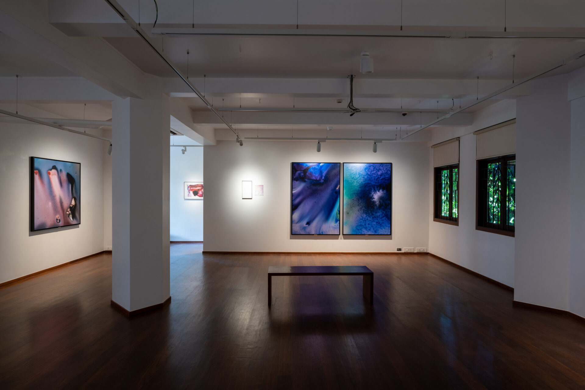 Best galleries in Mumbai | A shadowy installation shot inside TARQ gallery in Mumbai, showing works by Philippe Calia