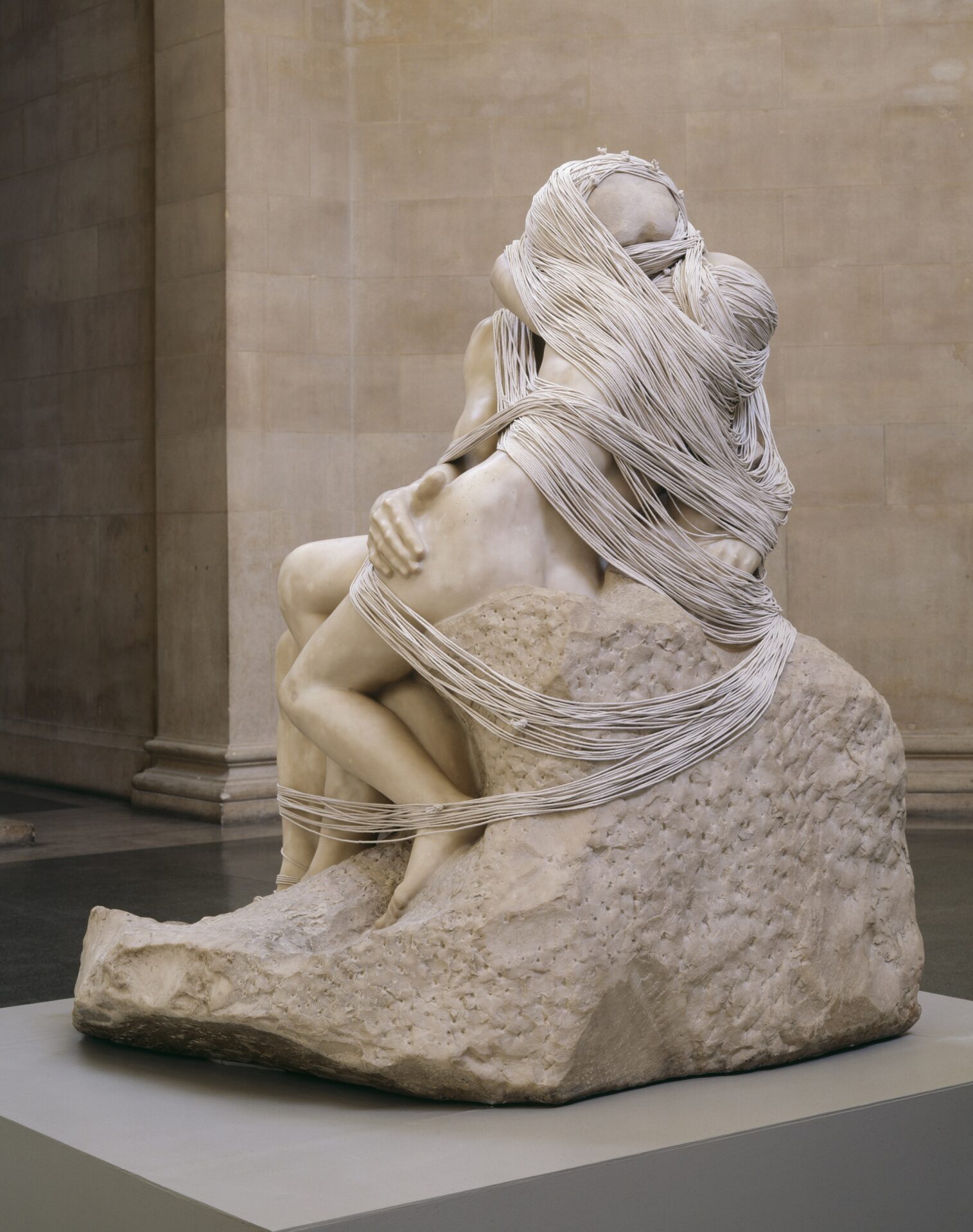 Things to do in London this month | A stone statue of two figures kissing, their faces obscured but string wound around them