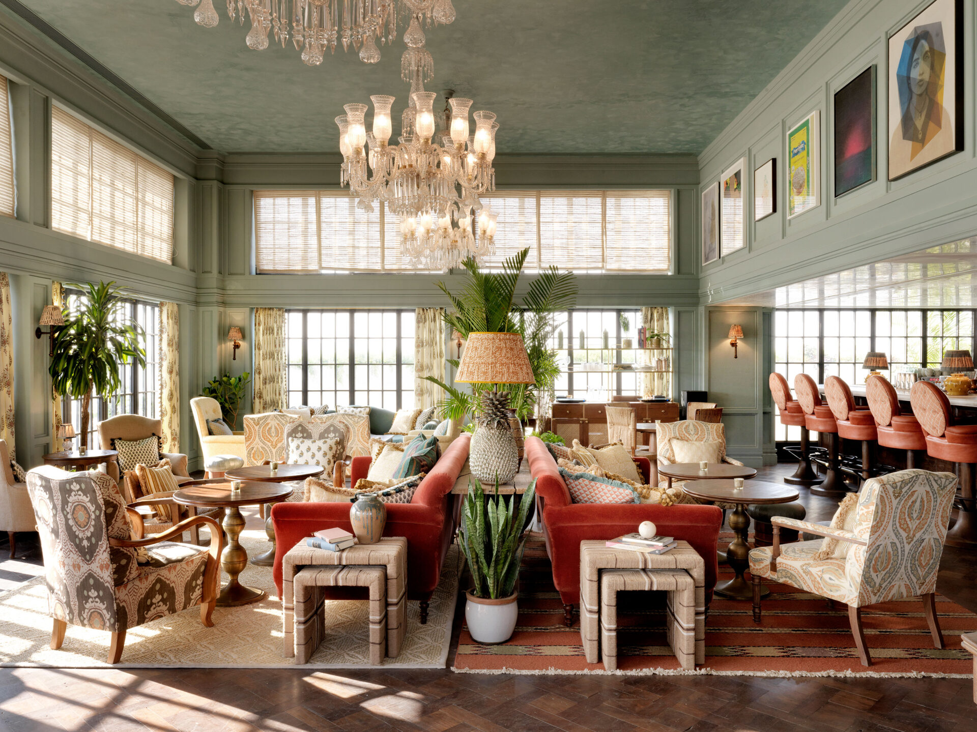 The interior lounge at Soho House Mumbai, with a chandelier overhead