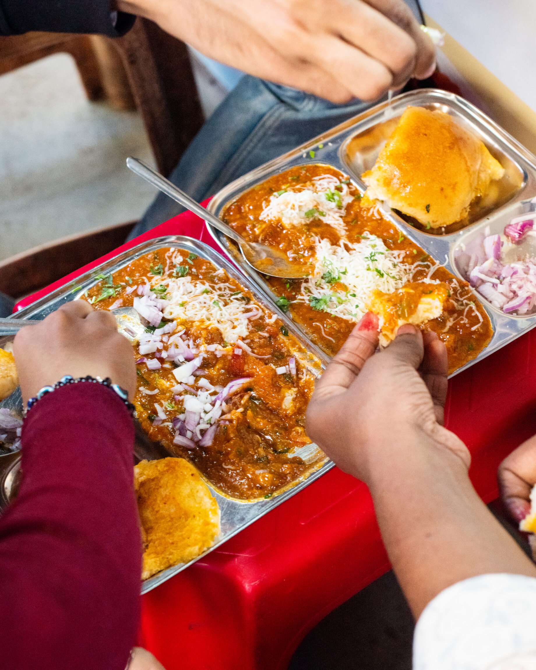 Diners digging into Pav Bhaji at Lenin Pav Bhaji at the Marine Lines