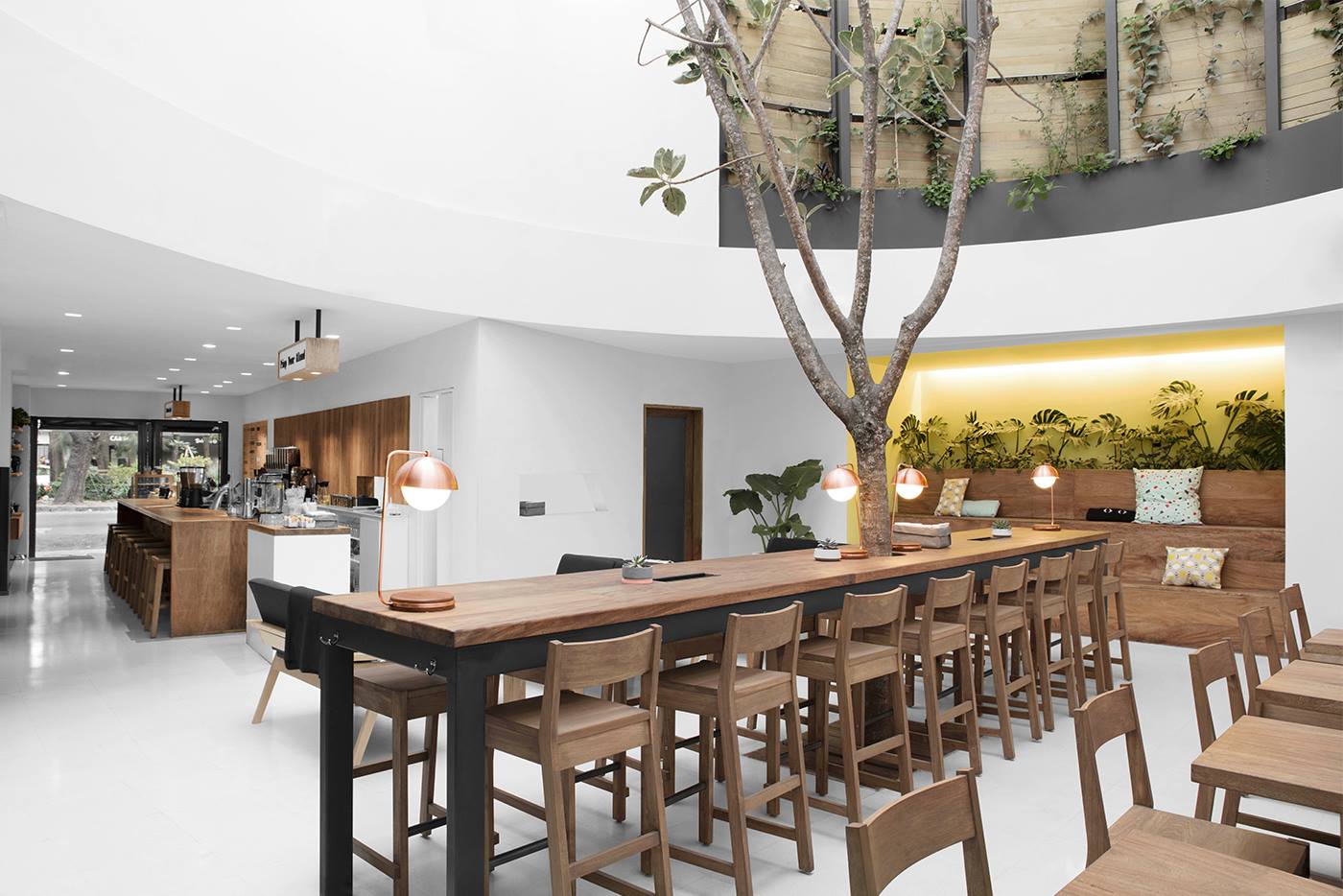 Blendstation in the Condesa neighbourhood, with high ceilings white walls and a long, dark-wood central table