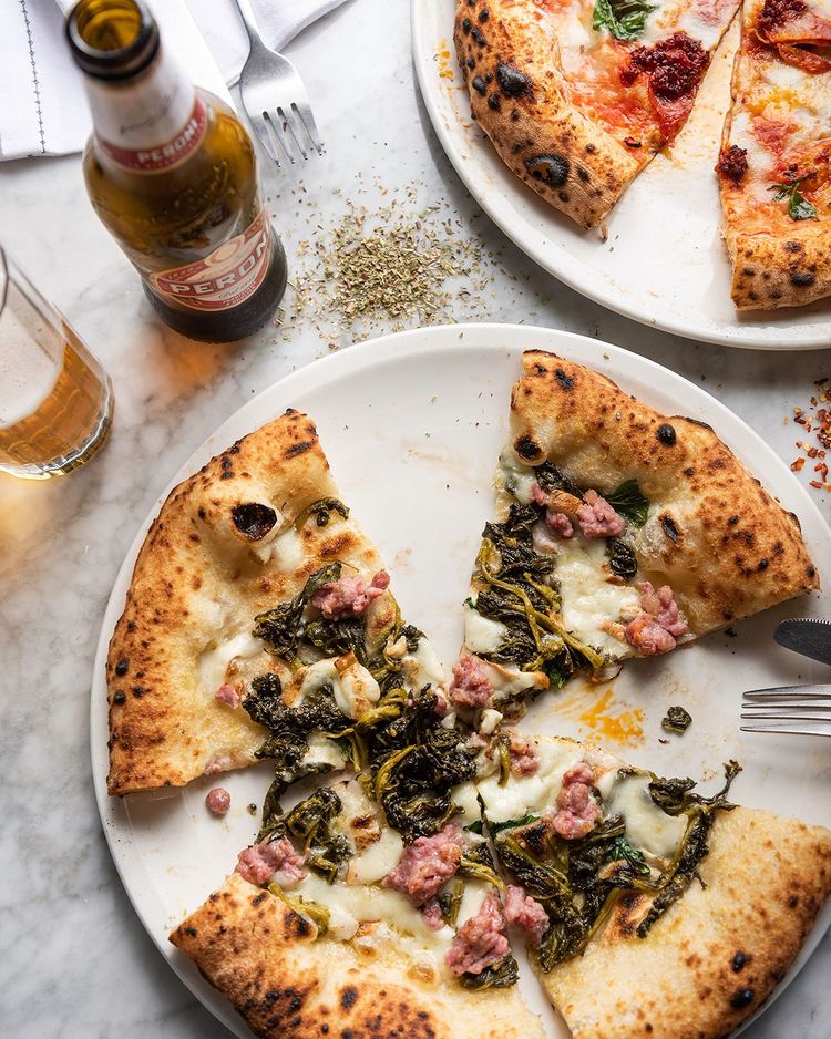 Aerial view of pizza and beer at O'ver, an Italian restaurant in Borough, London