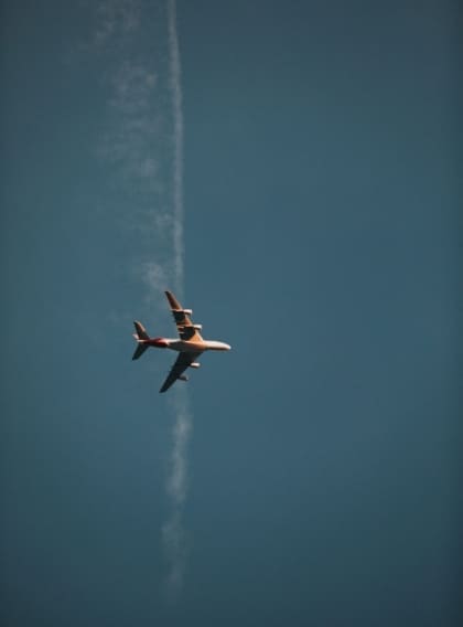 Airline news and trends | A plane shot from below against a blue sky