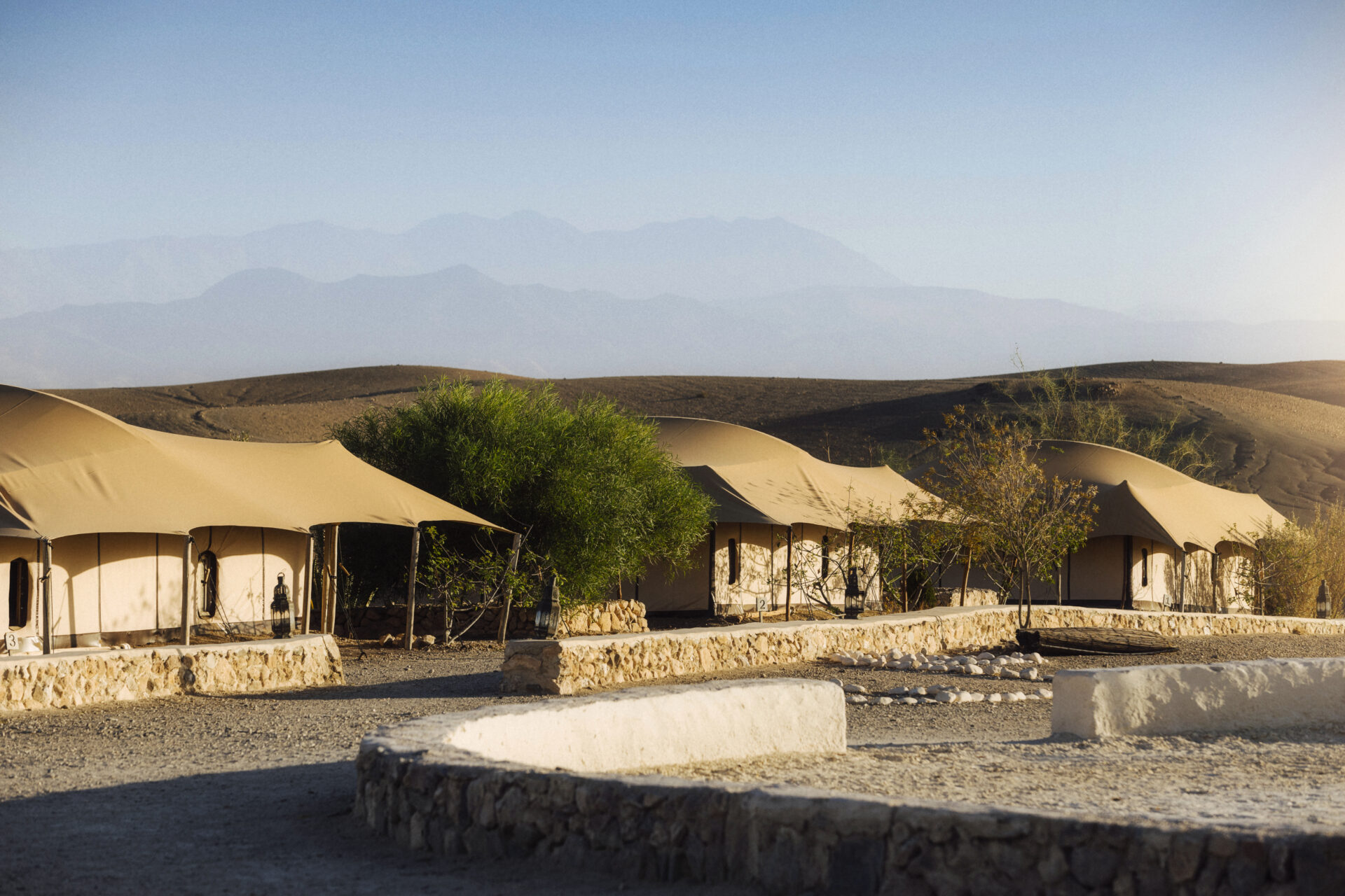 Canvas tents beneath a blue sky in Atlas Mountains, Morocco