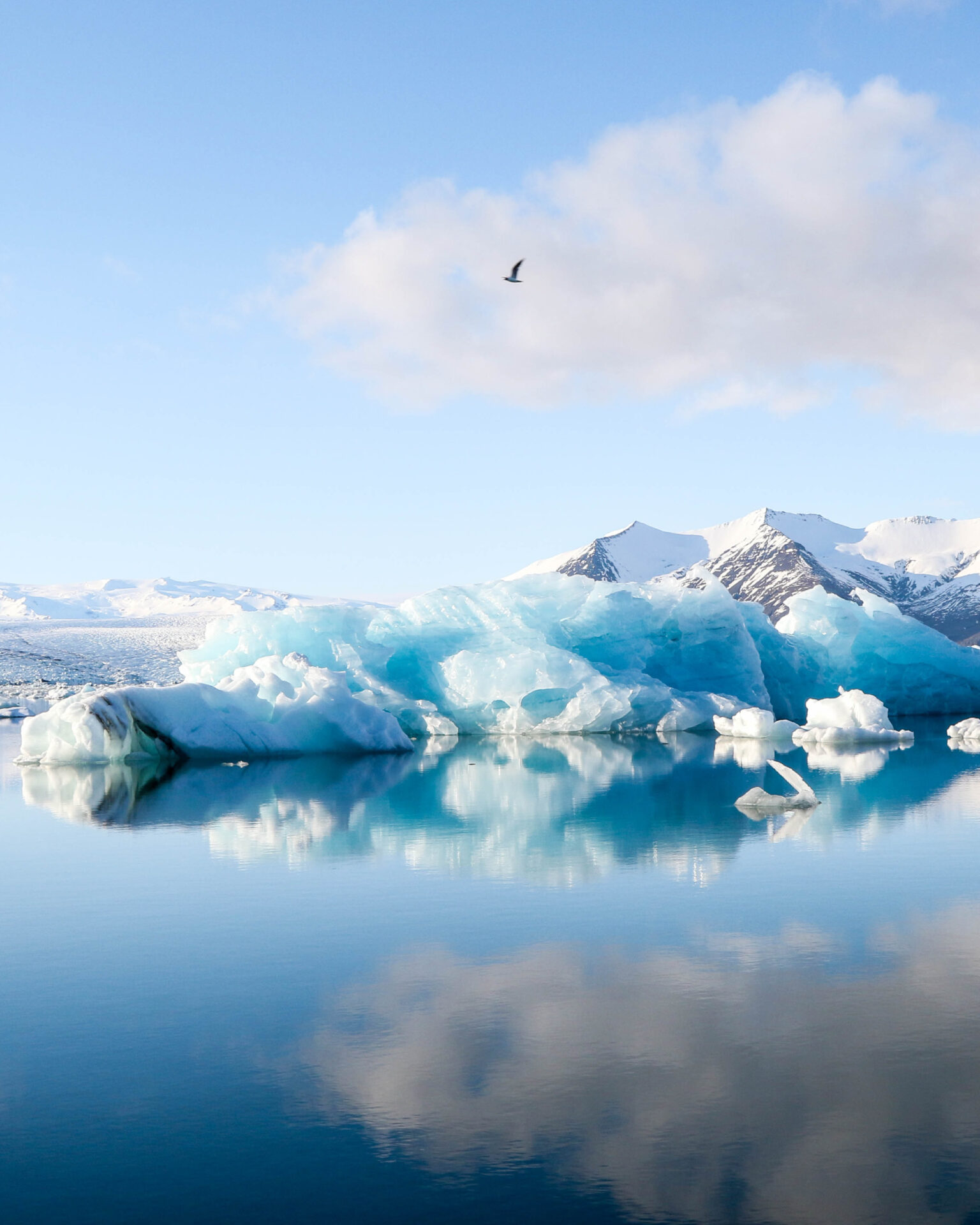 A view of iceland, with mountains and clouds in blue and white