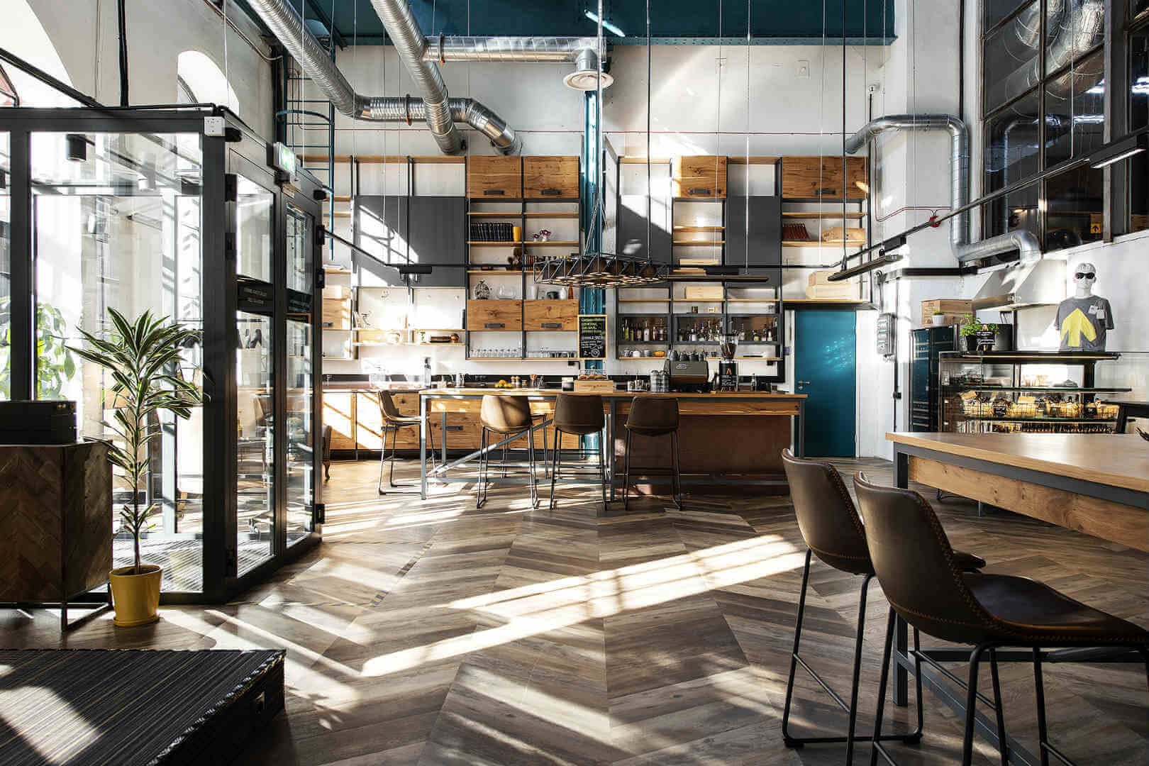 Lounge area at The Hektor Container Hotel in Estonia with a bar and tables