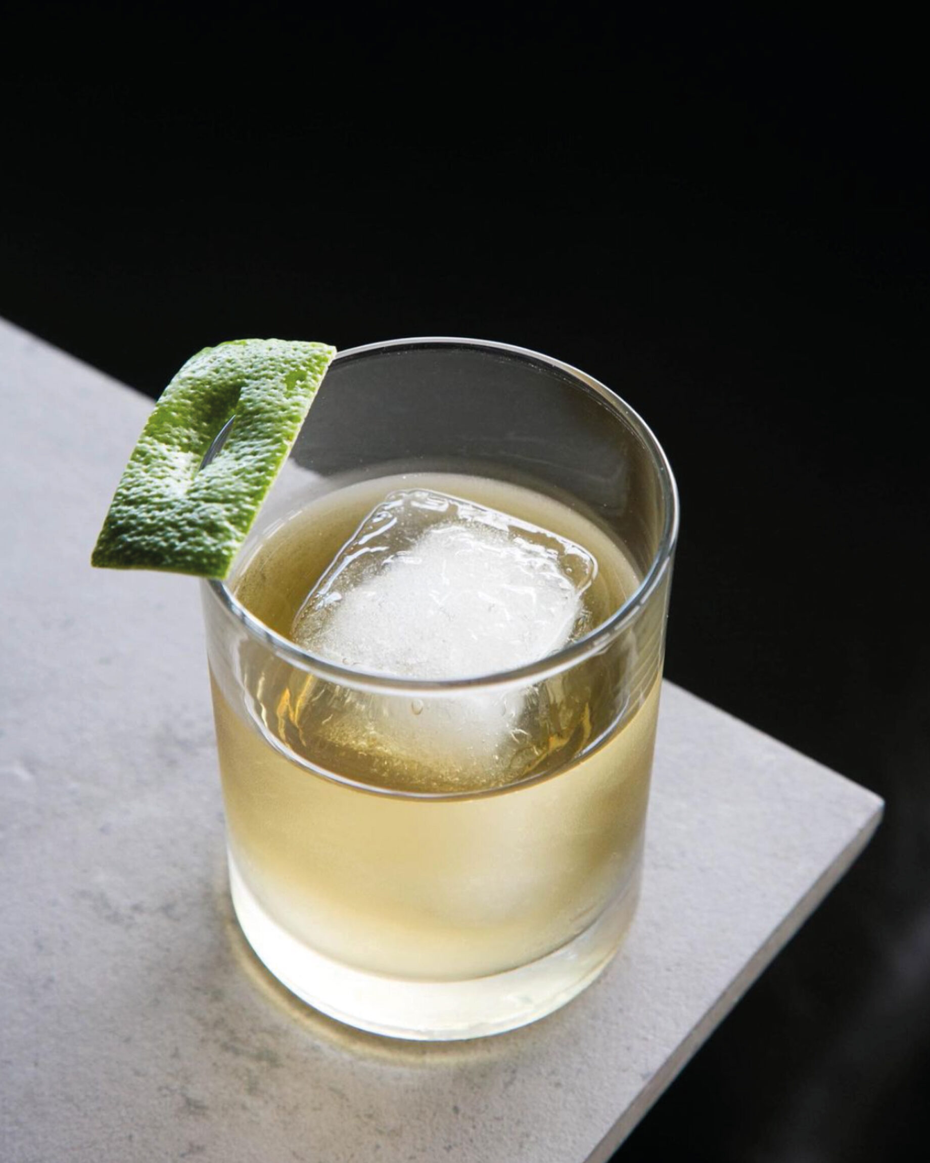 LA’s Ivan Vasquez on what it means to be Oaxacalifornian | Pale yellow cocktail garnished with a lime wedge