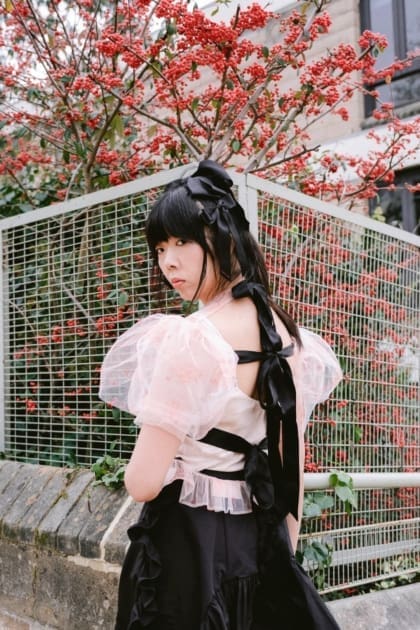 Susie Lau on Hong Kong | A portrait of Susie by a red berry tree