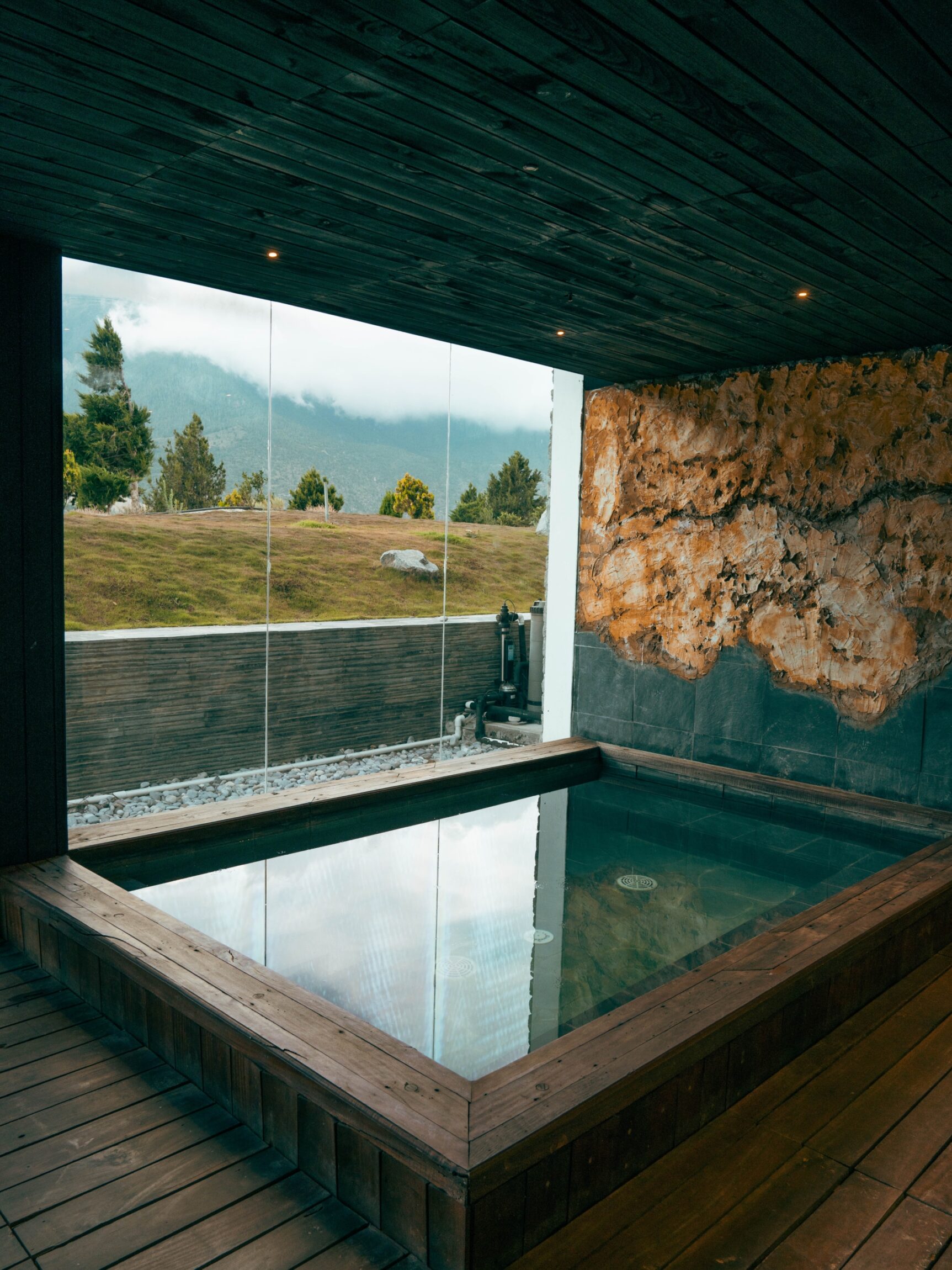 a sauna by a floor-to-ceiling window at Shinta Mani Mustang, Nepal