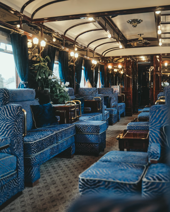 The best European trains | interior view of a Belmond train with vintage velvet furnishings