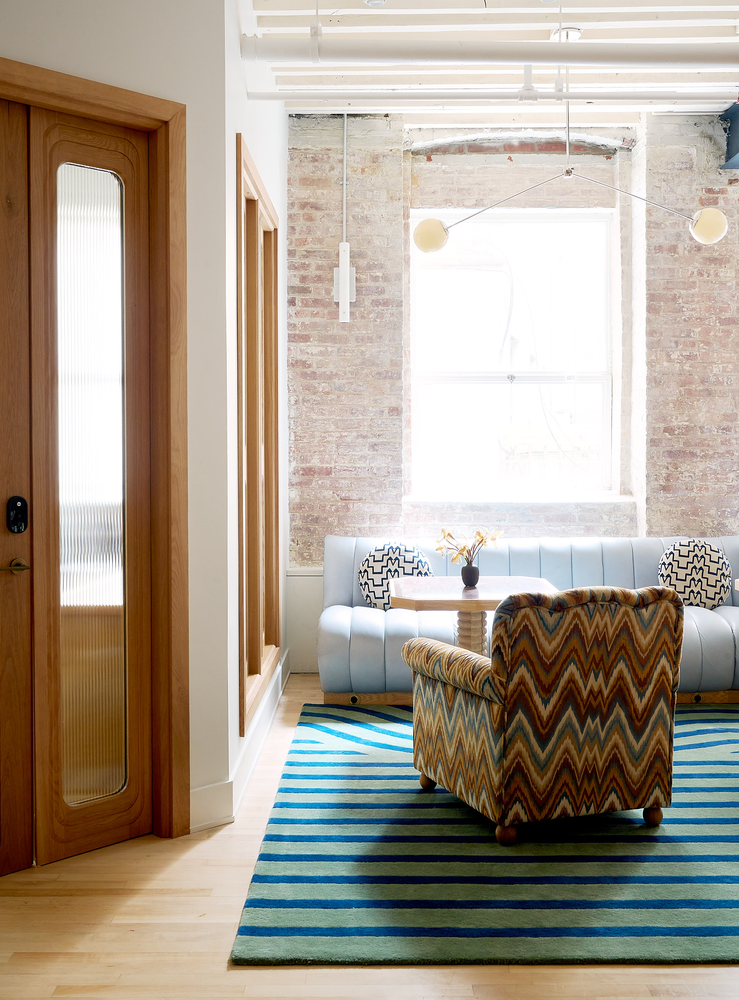 The best co-working space in NYC | A chevron stripe chair against a window at The Malin