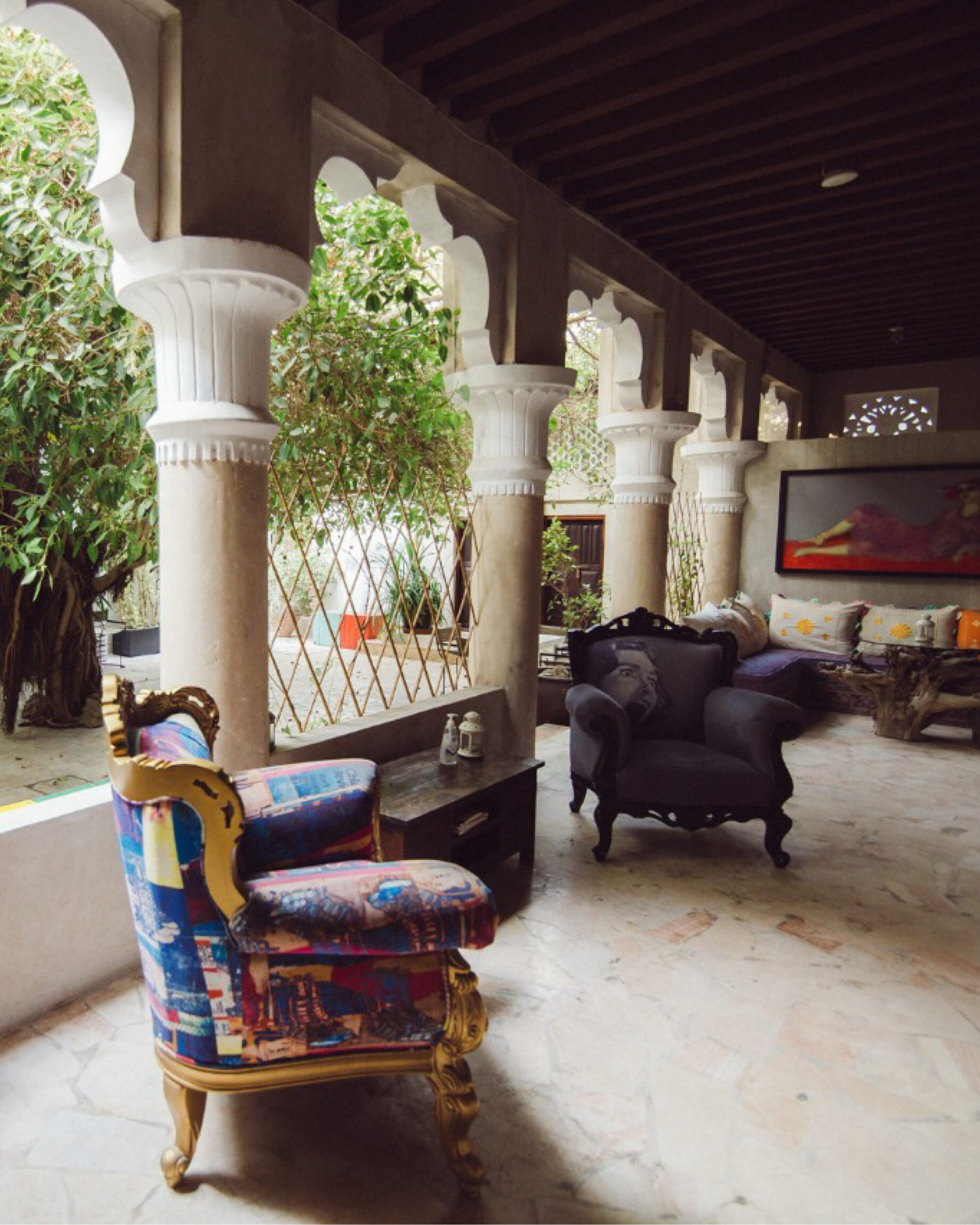 Printed accent chairs line the courtyard at XVA Hotel Dubai