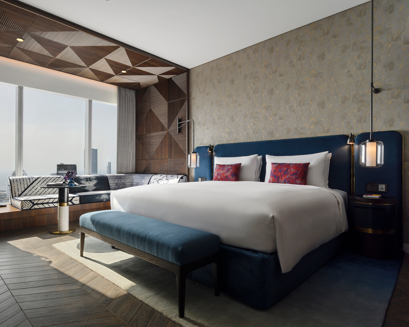 A super-king-sized bed decorates a room at S/O Uptown Dubai