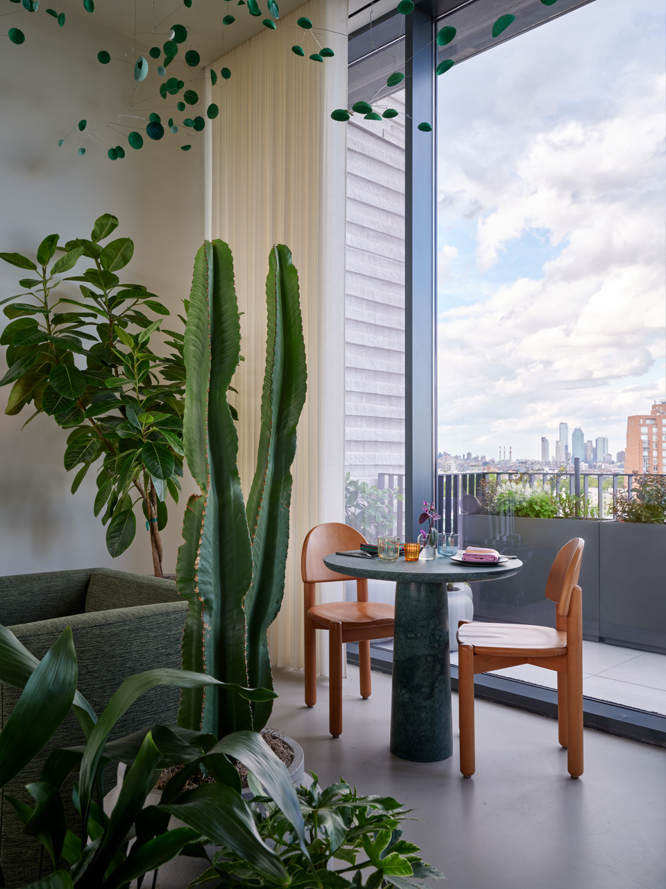 A table and chairs at elNico at Penny Williamsburg hotel in Brooklyn