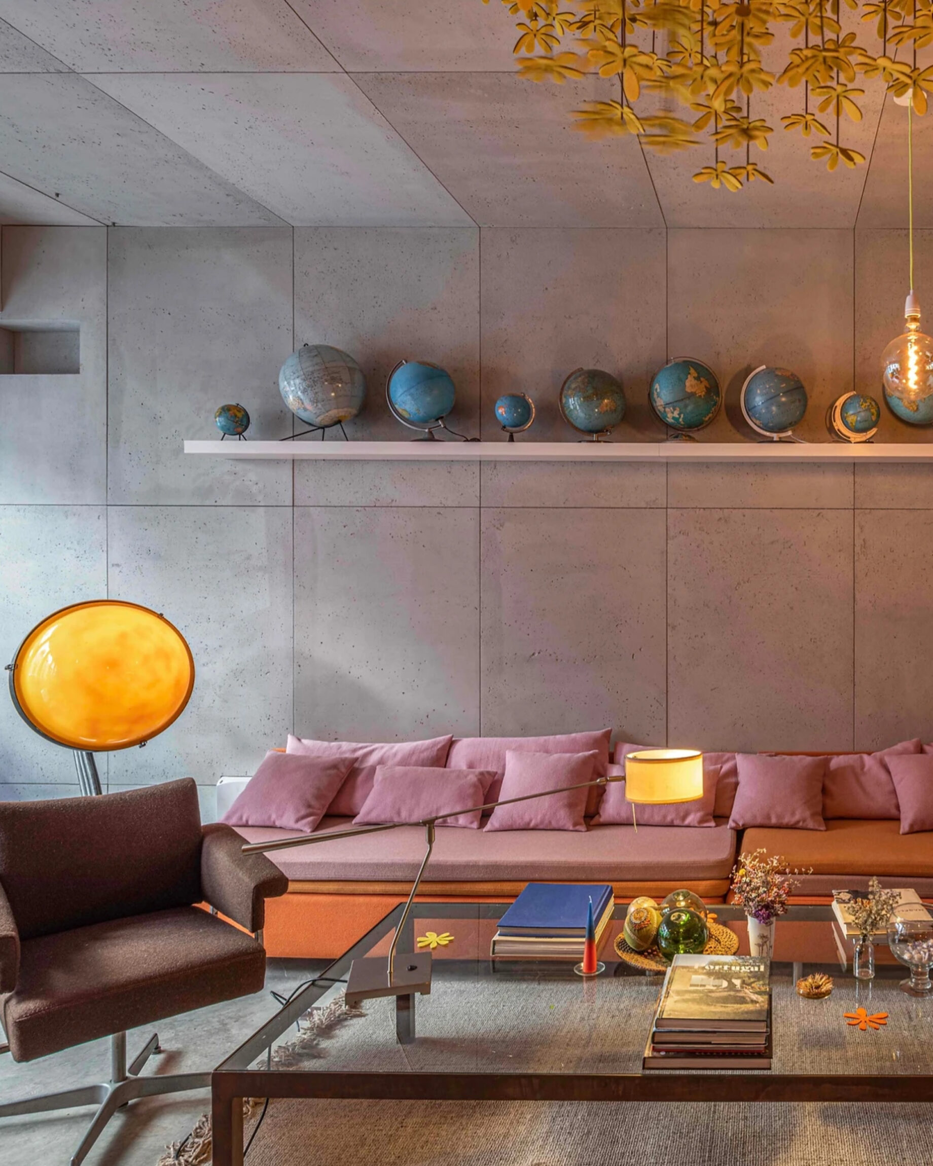 A pink sofa in a low-lit space at Toctoctoc hotel in Lisbon