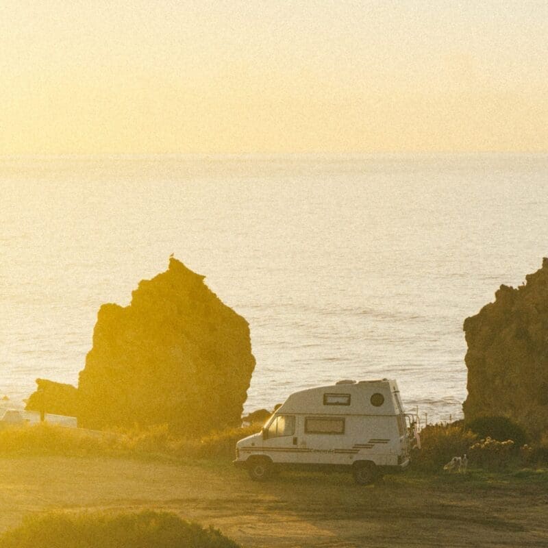 How is vanlife evolving? A fan against a hazy yellow sunset