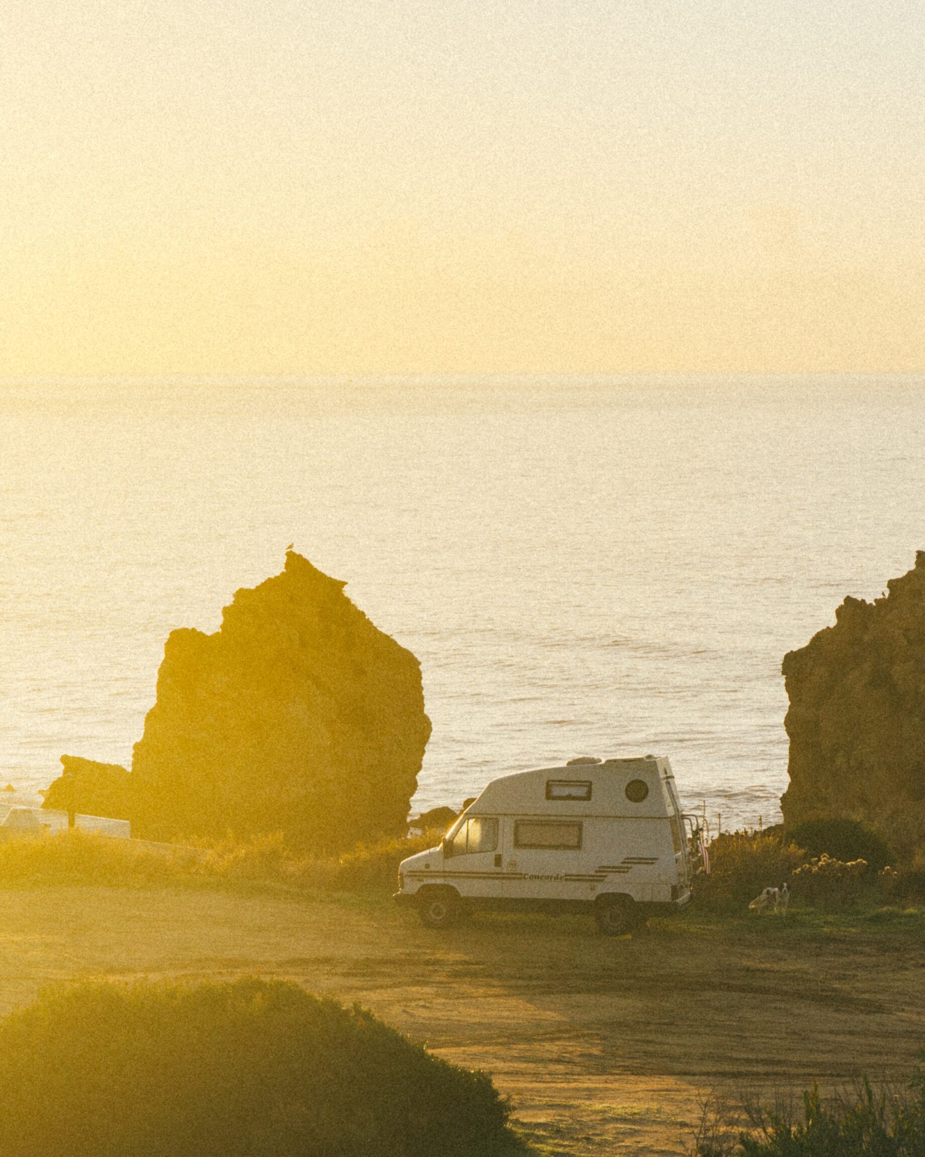 How is vanlife evolving? A fan against a hazy yellow sunset