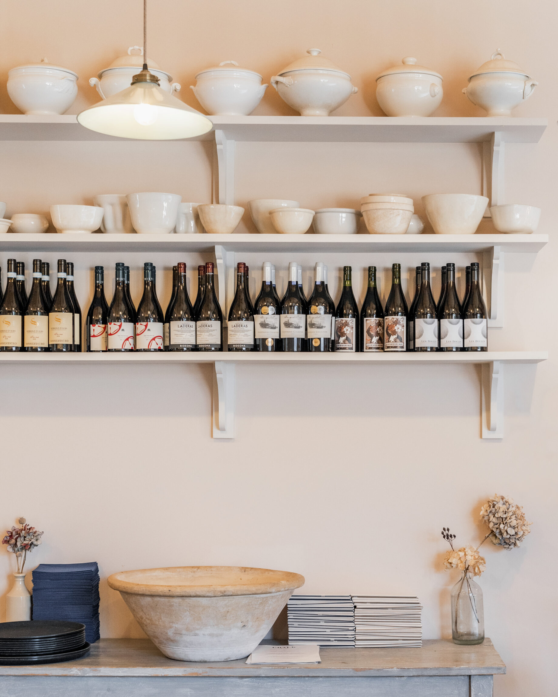 Bottles lined on a neutral shelf at Chalk, Wiston Estate