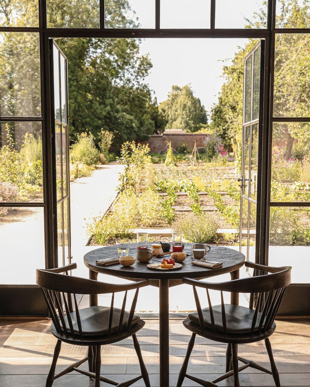 A table for two facing the walled garden at Grace & Savour, West Midlands