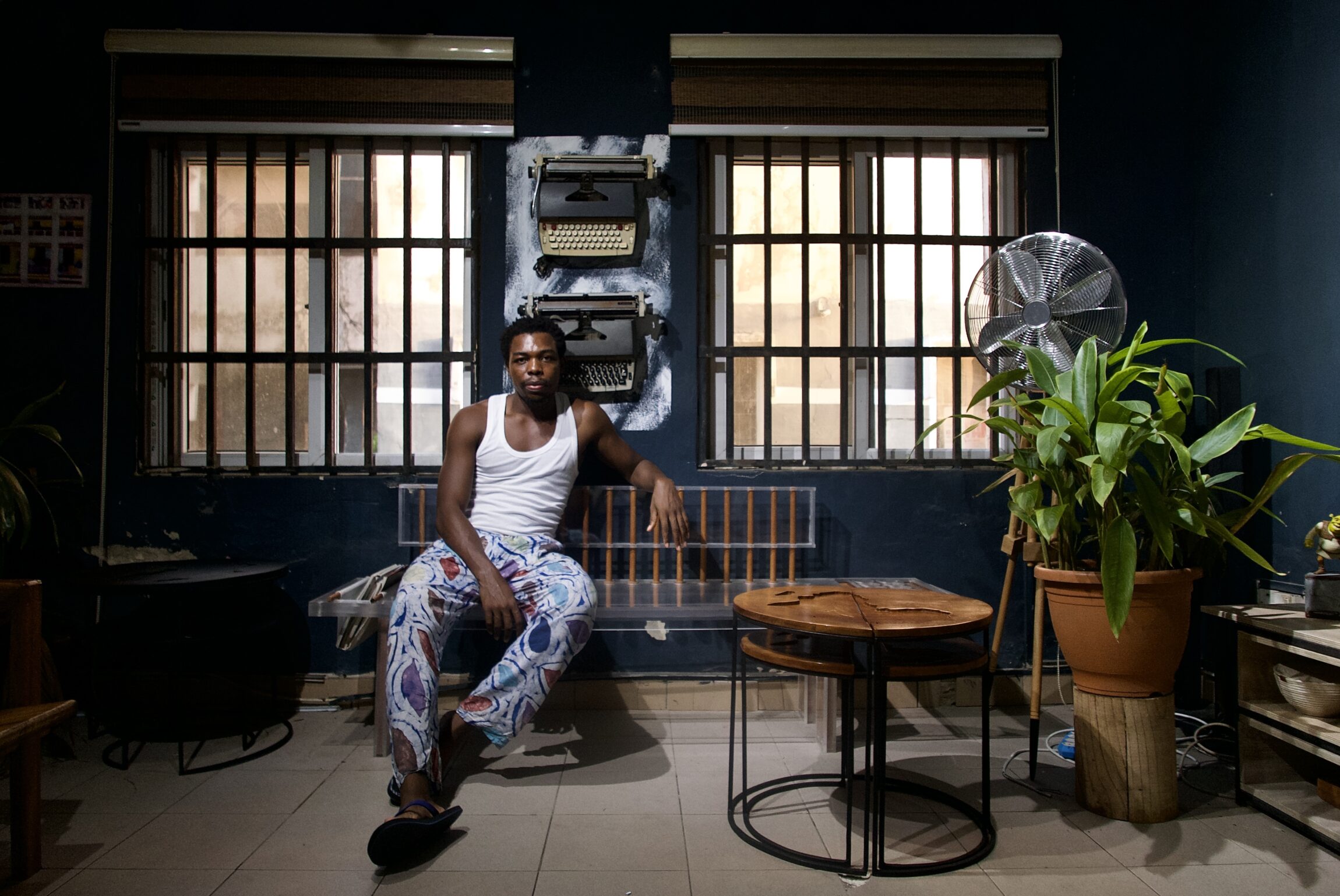 Industrial designer Josh Egesi surrounded by his pieces.