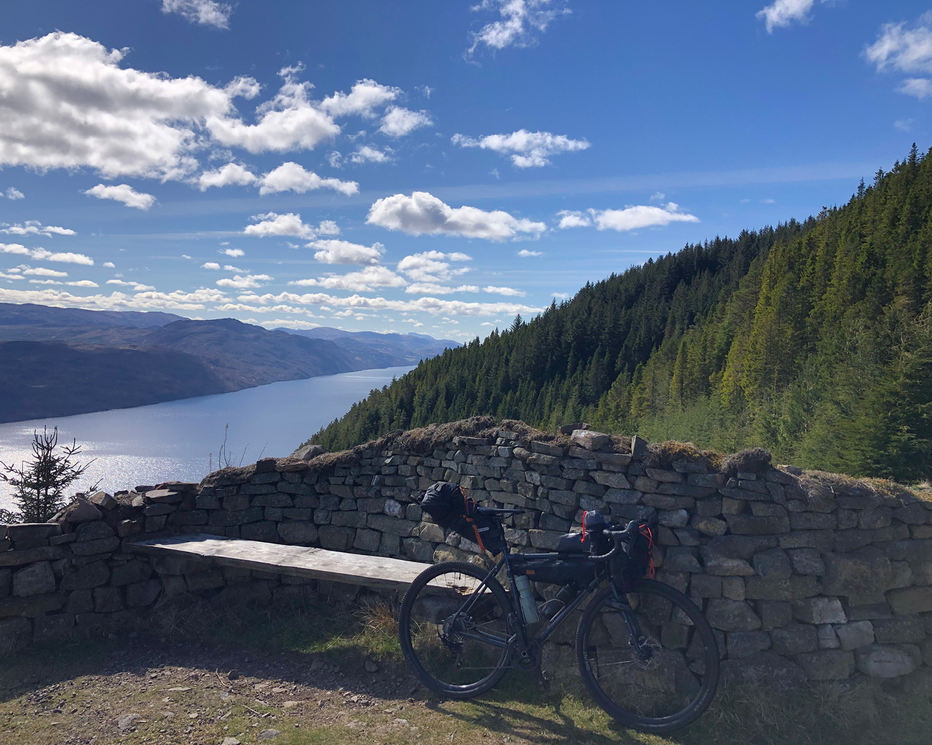 A gravel bike bikepacking setup with views of Loch Ness. Photo by Ollie Horne