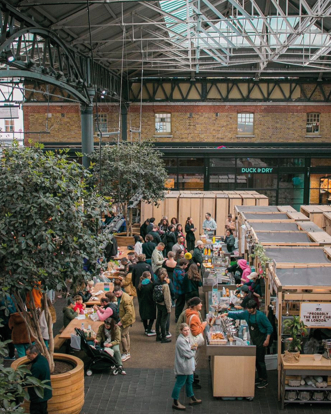 Shoreditch and Spitalfields | food stalls at Old Spitalfields Market beneath a lofty industrial ceiling