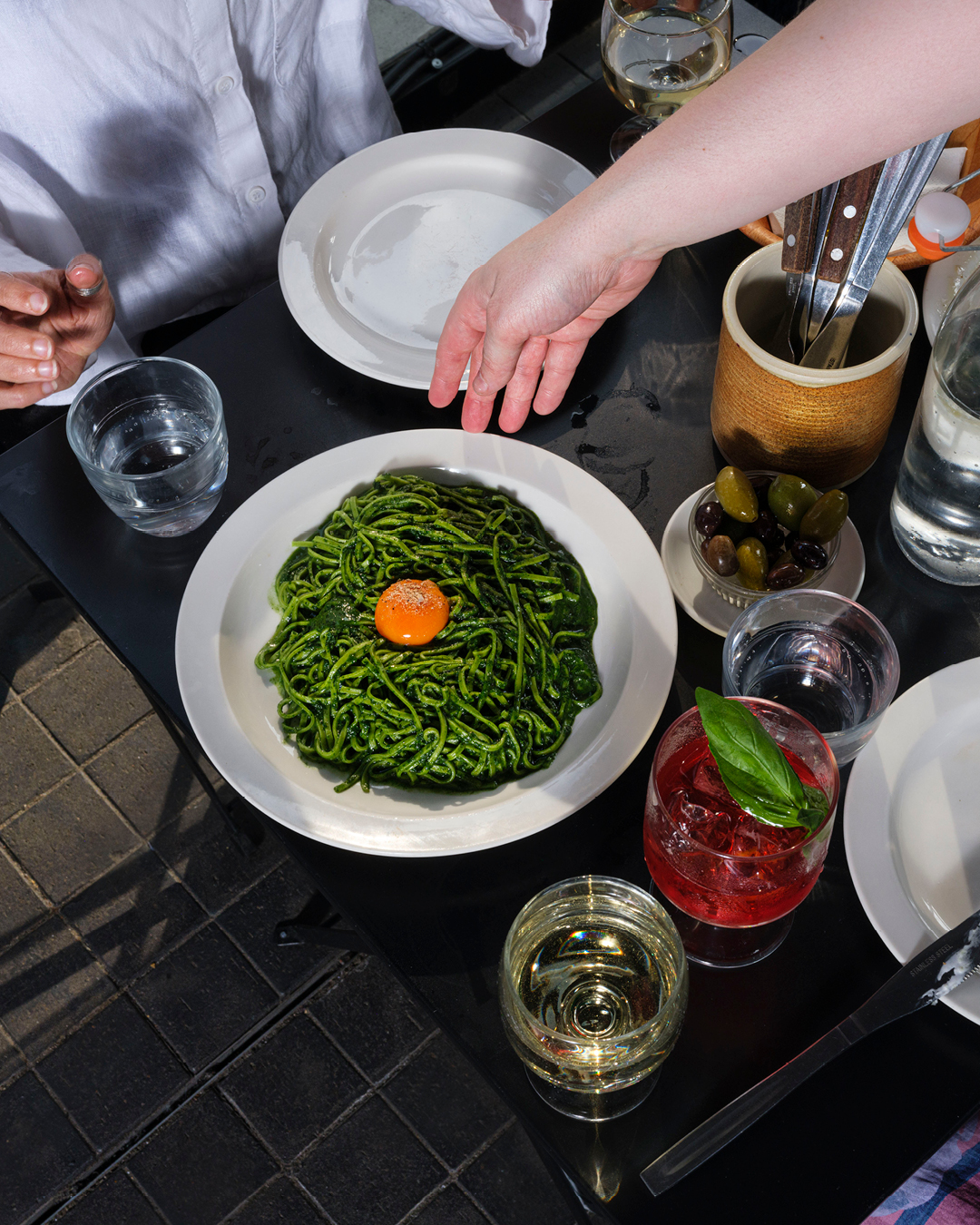 a plate of pasta topped with an egg at St John Bread and Wine