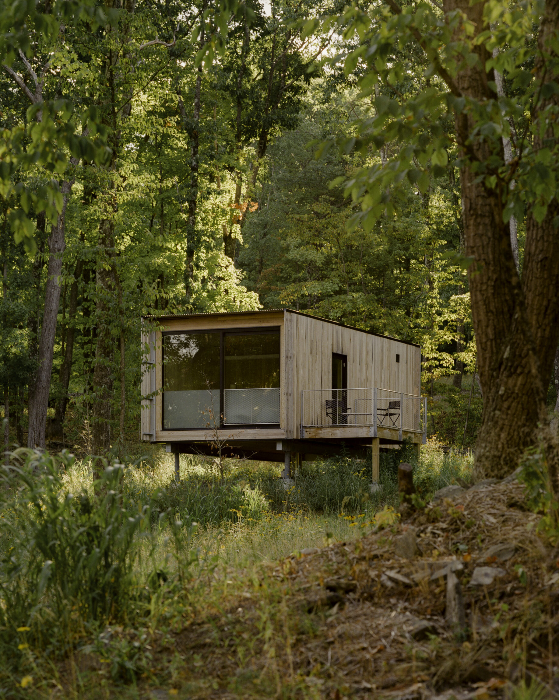 Where to stay in the Catskills | a wooden cabin a forest setting at Piaule Catskill