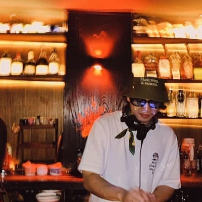 The best restaurants and bars in Bangkok's Thonglor | A DJ performs behind a set of decks at Thaipioka bar in Thonglor, Bangkok.