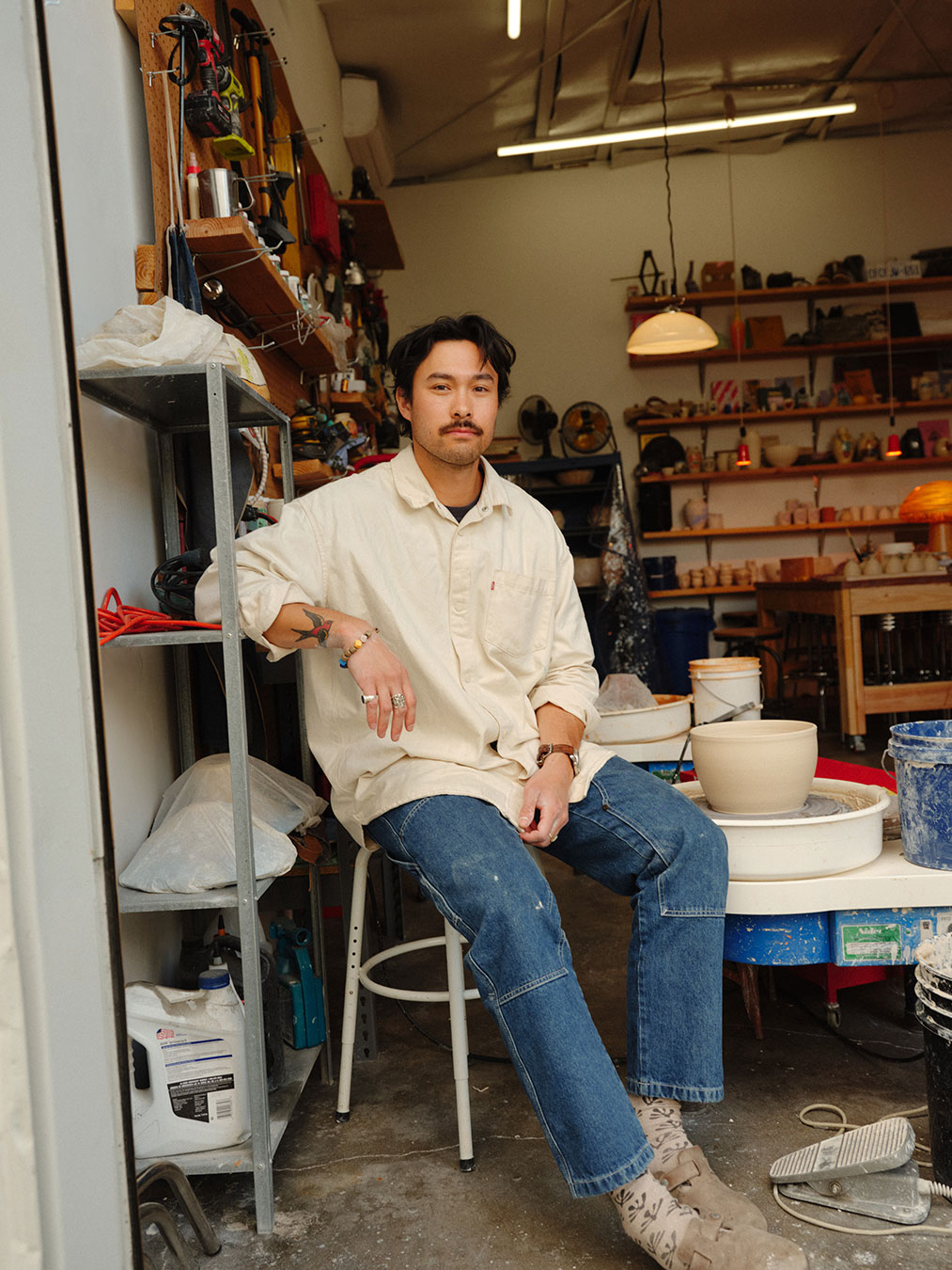 Daniel Dooreck sat by the wheel in his studio.