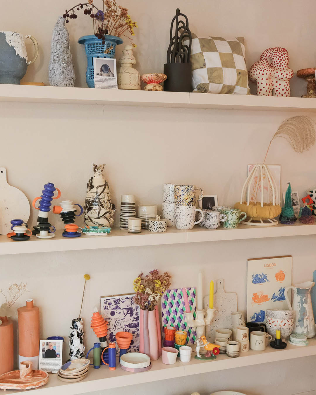 Ceramics, cushions, candles and other homewares on shelves at Kintu Studio, Lisbon.