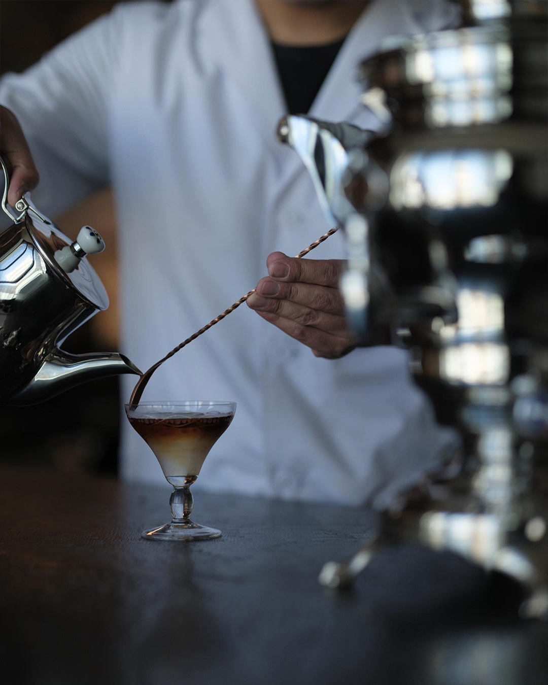 Creating a drink at Sakurai Japanese Tea Experience.