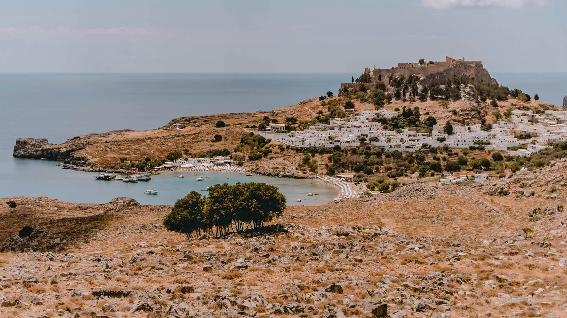 Cove and headland and small coastal town in Greece