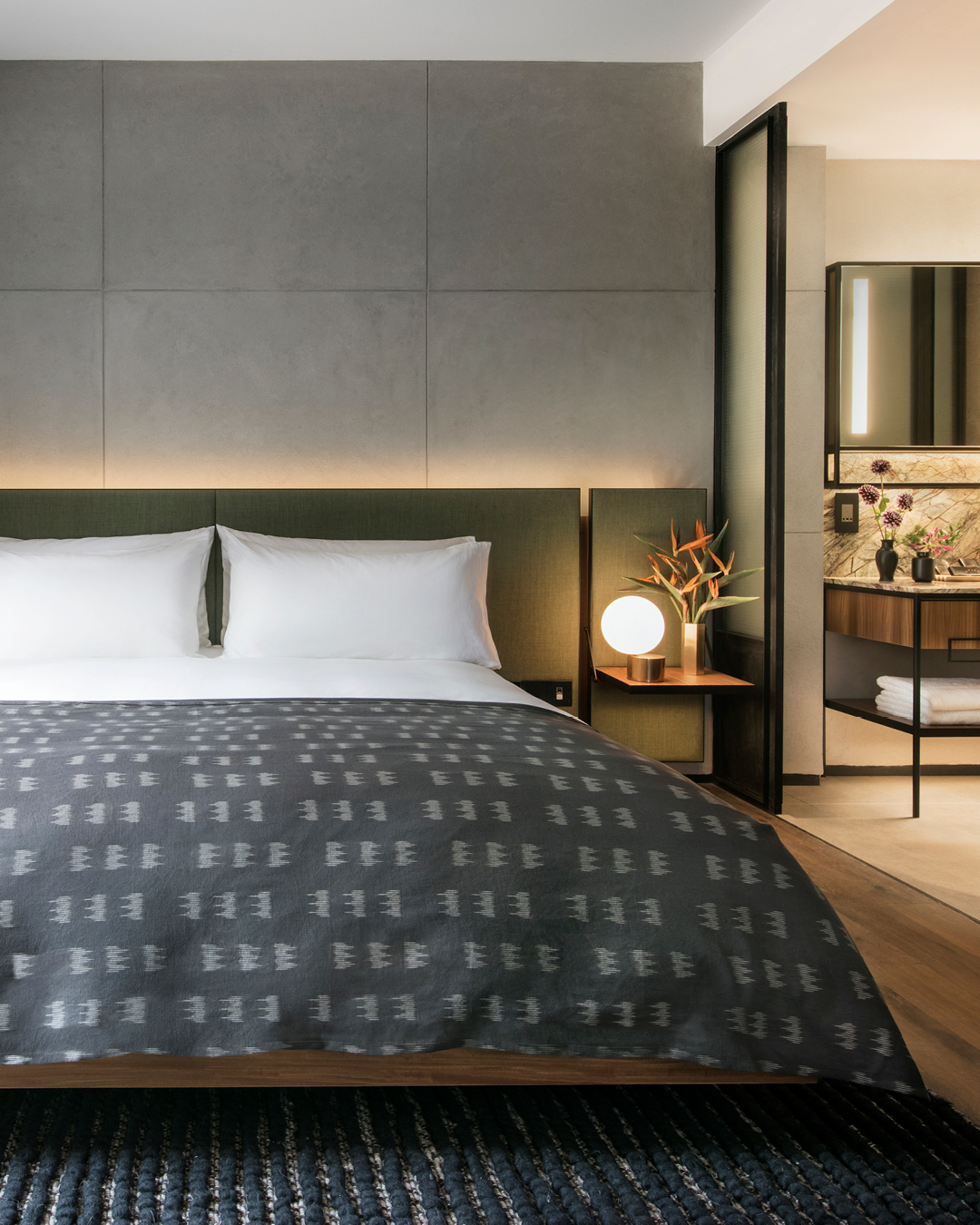 the warehouse hotel bed with throw