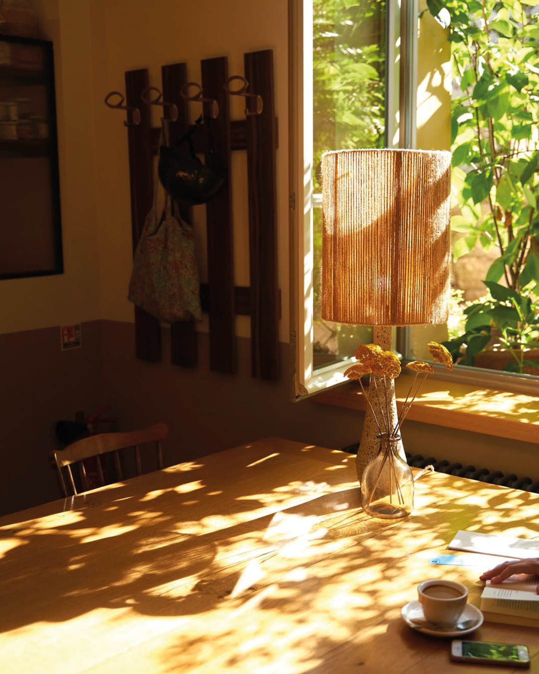 Sunlight filters through a window at Tram Café in Paris.