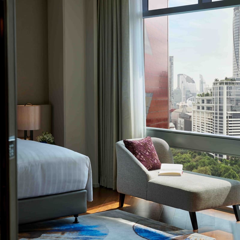 window view from premier room showing bed and chaise lounge