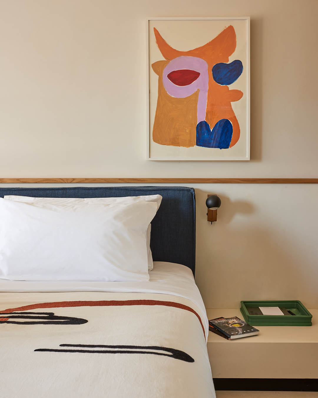 A cosy bedside corner at Ace Hotel and Swim Club in Athens