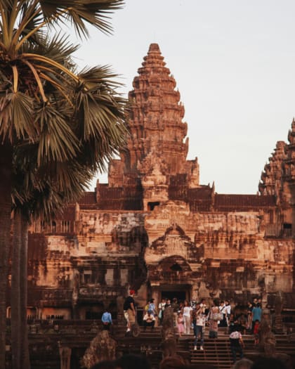 Tourists visiting Angkor Wat, Cambodia, at sunset