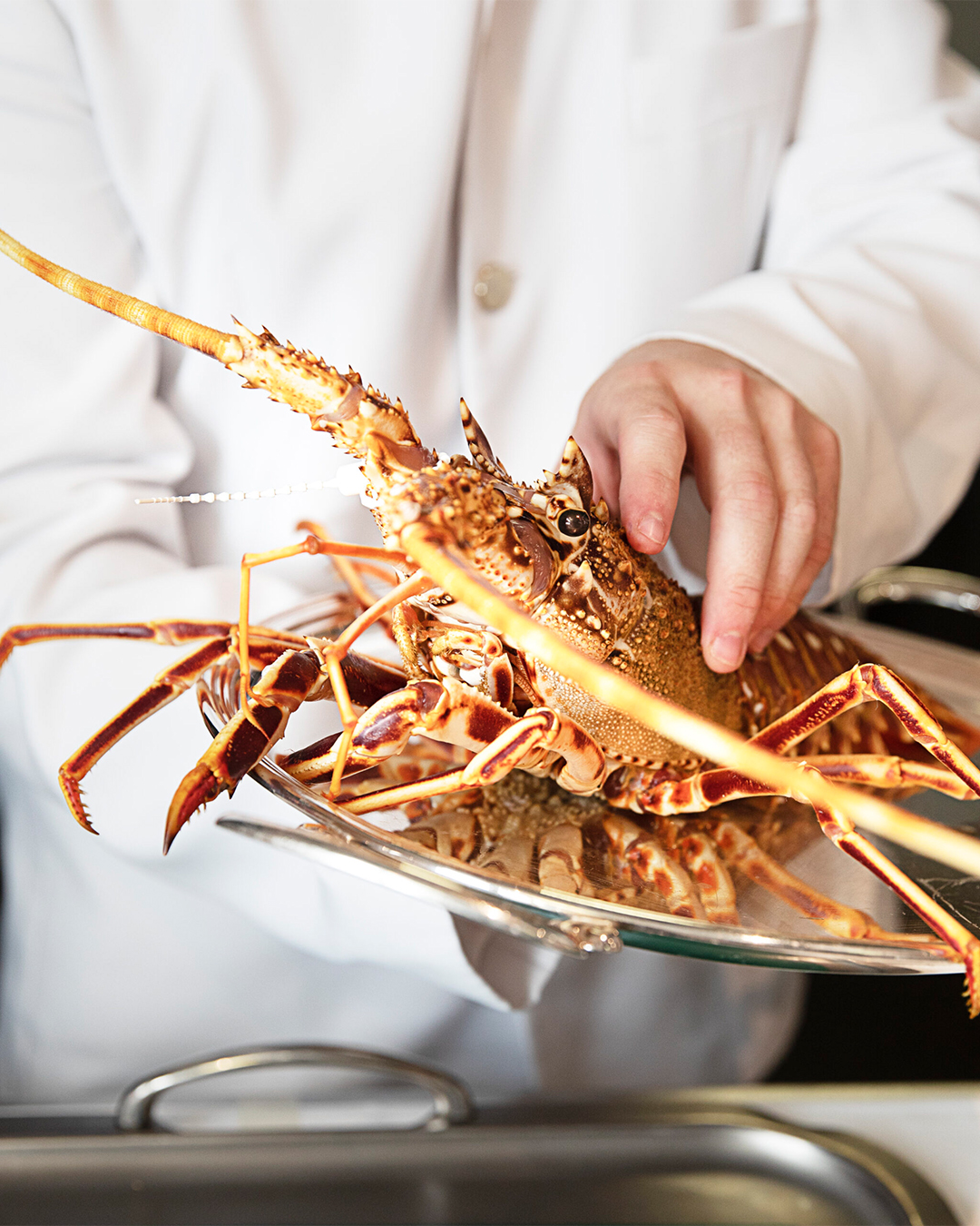 Crab preparation at Le Clarence, Paris