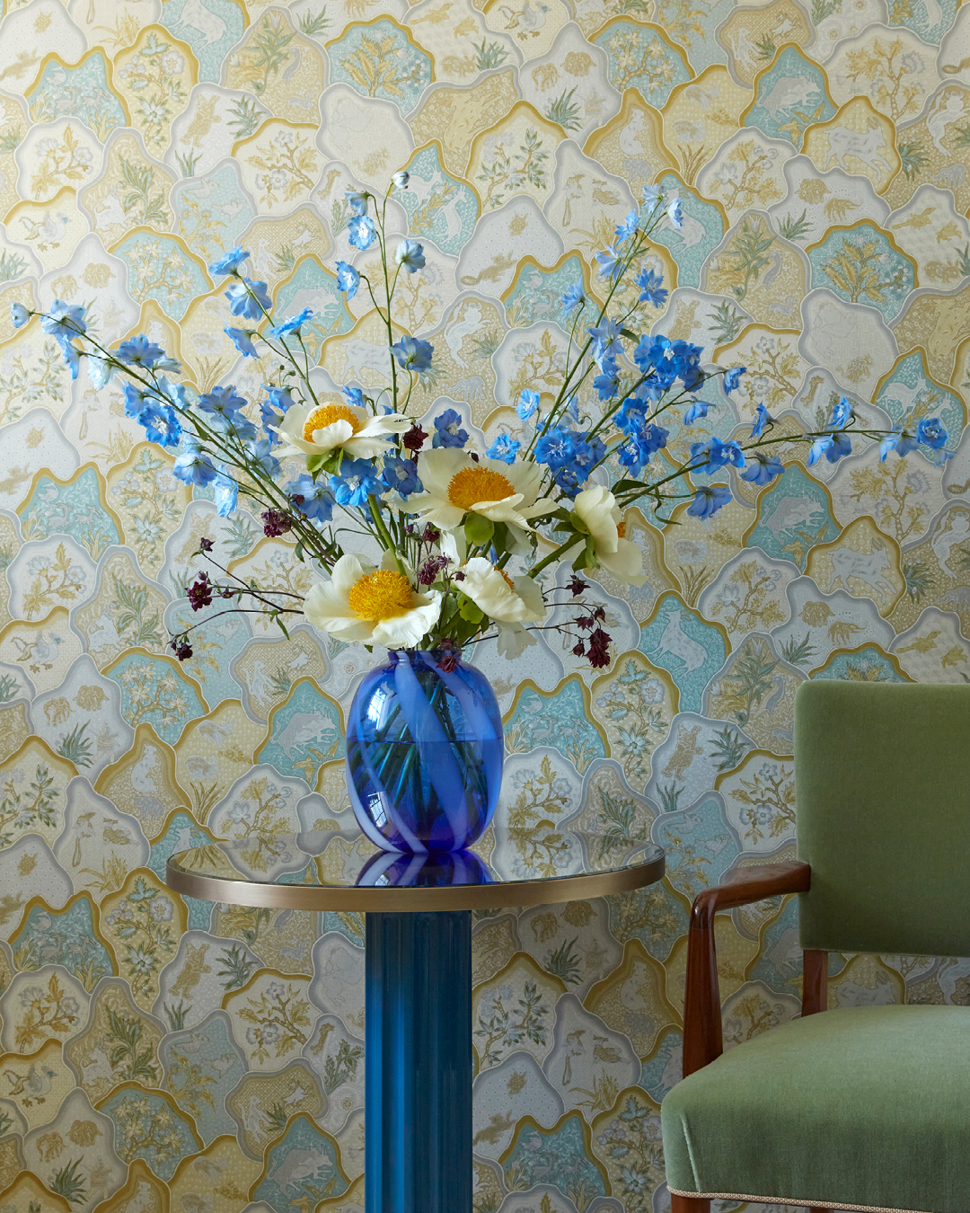 A blue vase with a fresh flowers in a suite at Broadwick Soho